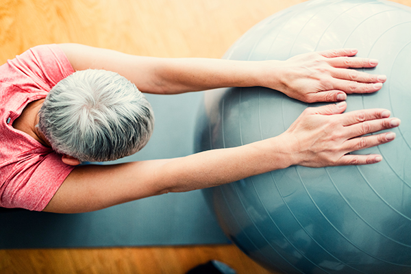 Mature woman stretching