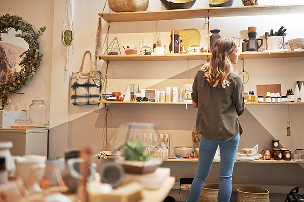 Woman in a shop looking at items 