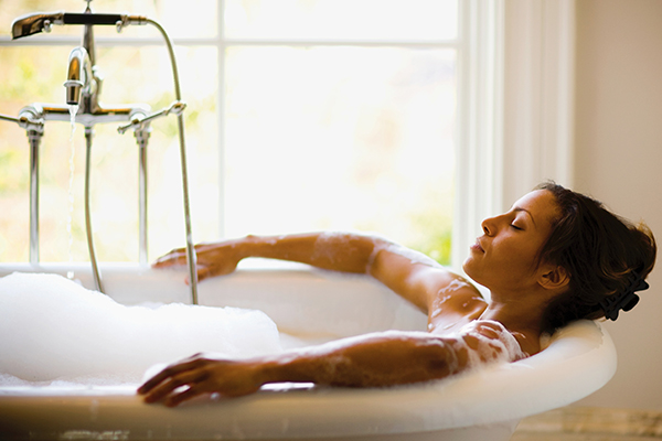 Woman taking a bubble bath