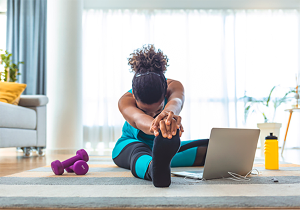 Woman stretching at home