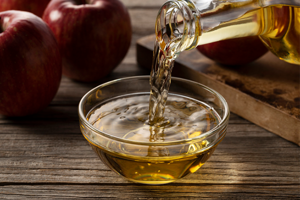 pouring apple cider vinegar | Fermented Foods