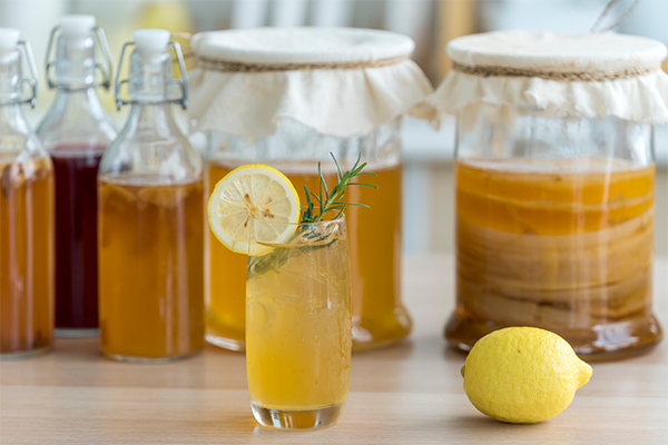 glass and jars of kombucha | Fermented Foods