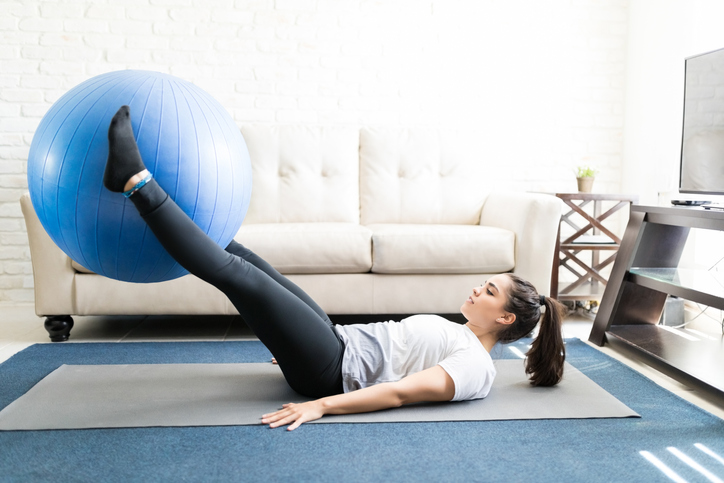 woman doing leg lifts with stability ball | leg lifts