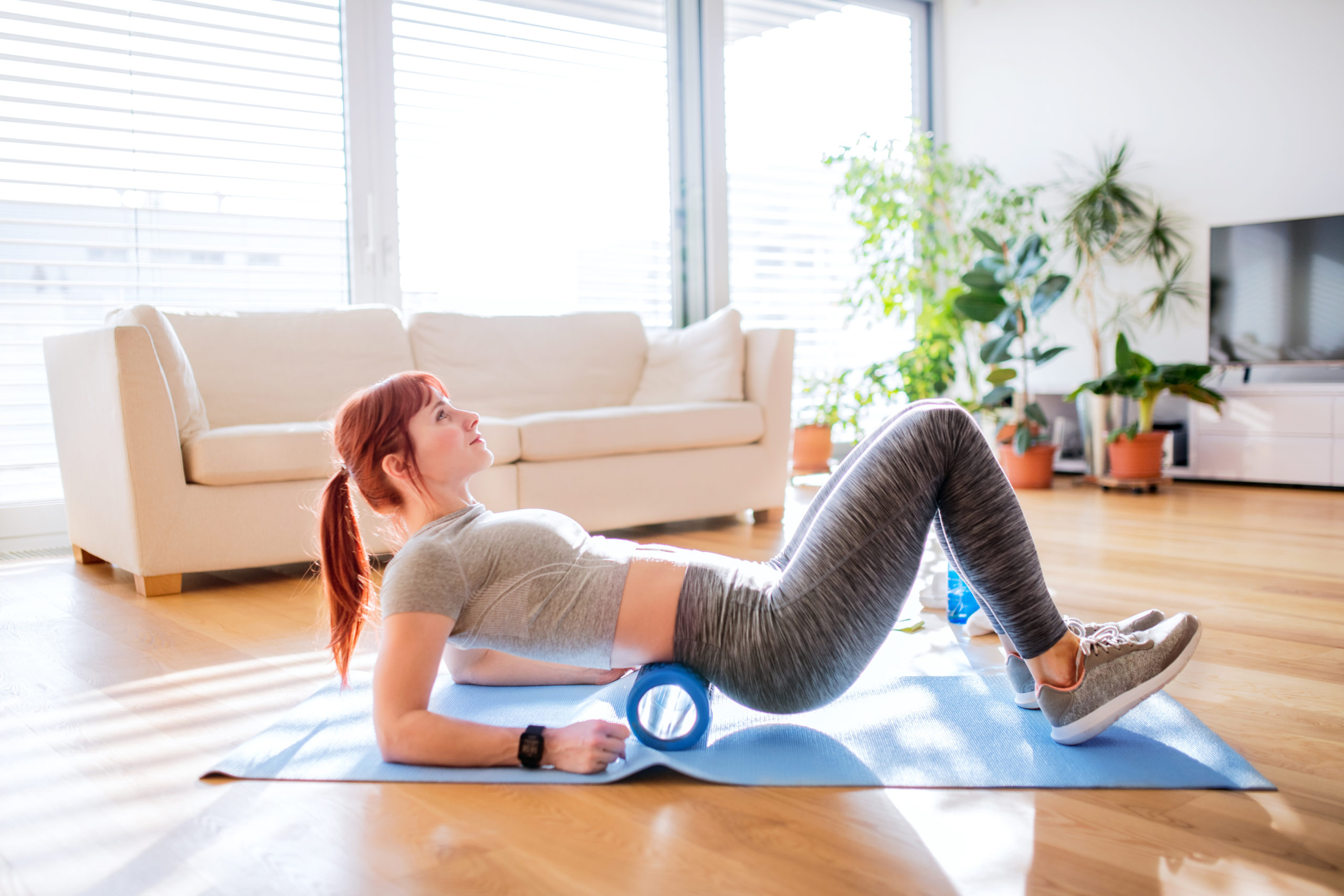 Woman Foam Rolling | Hot Or Cold Shower After Workout