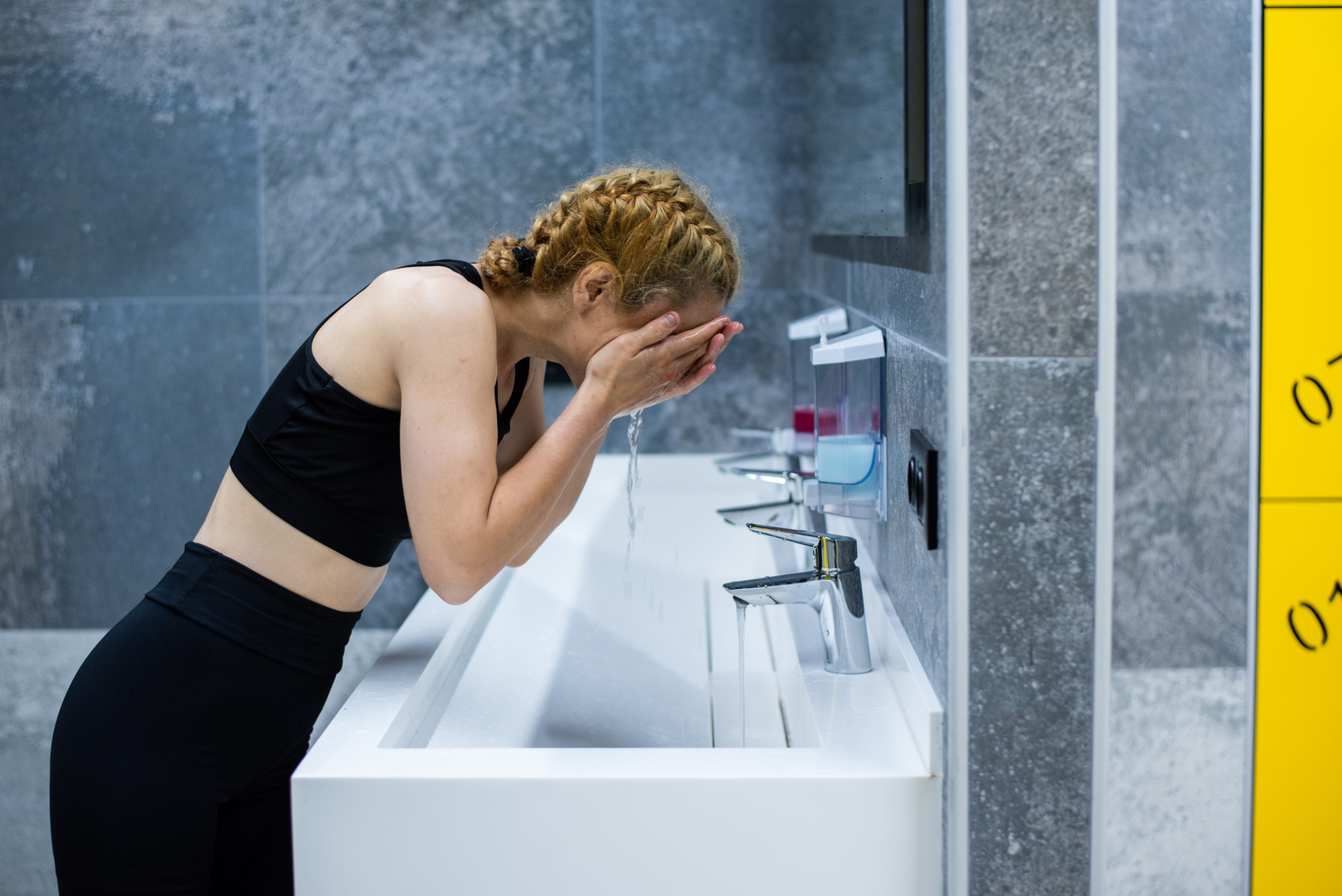 Woman at Sink | Hot Or Cold Shower After Workout