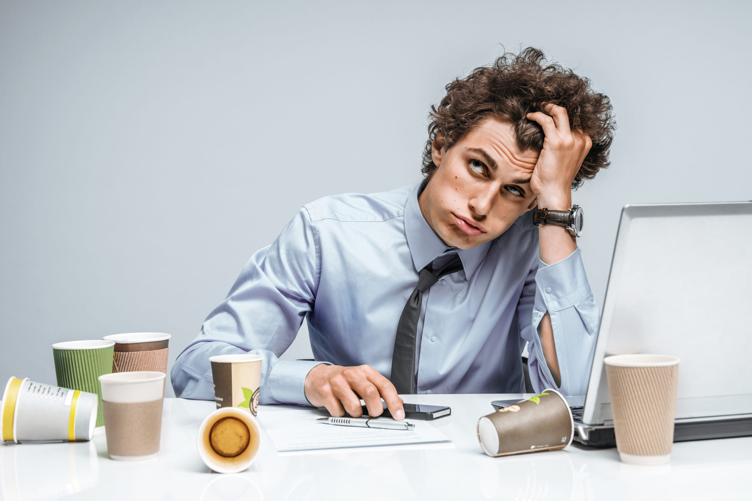 Overworked Employee | how much caffeine should you have a day