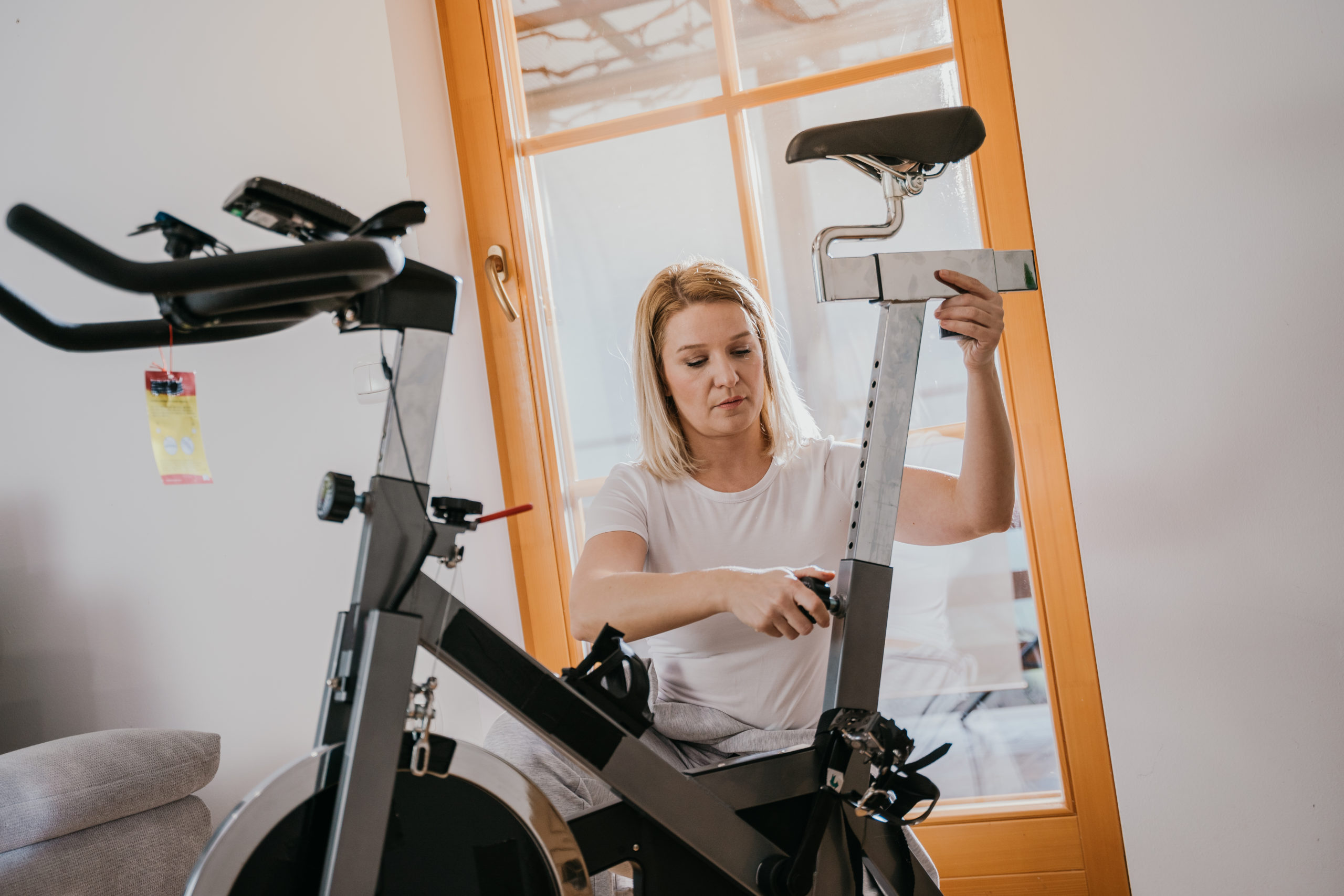 Woman Adjusts Seat | Knee Pain During Cycling