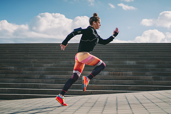 Woman Runs in Front of Stairs | Pose Running