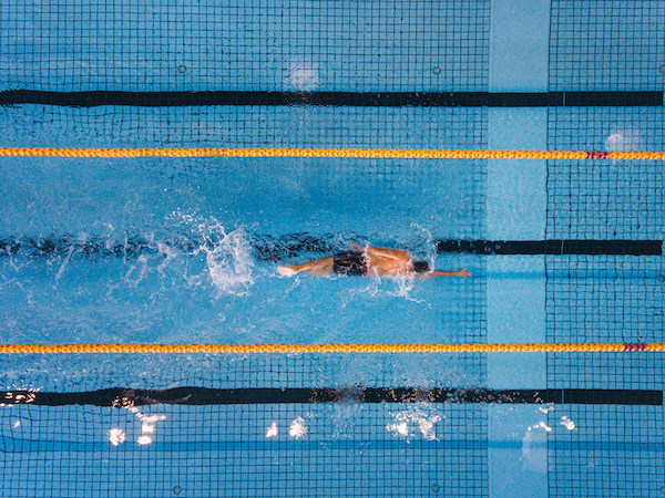 Swimmer in Olympic Pool | Benefits of Swimming