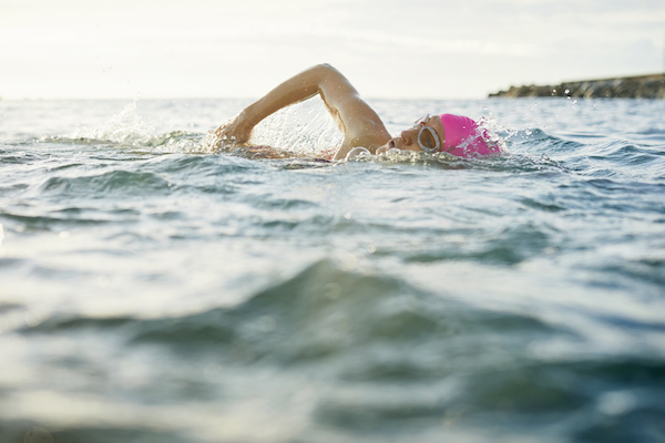 Woman Swims in Ocean | Benefits of Swimming