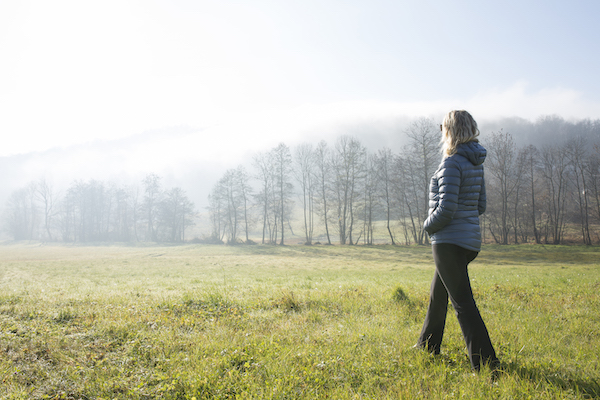 Woman Walks in a Field | Inexpensive Self Care