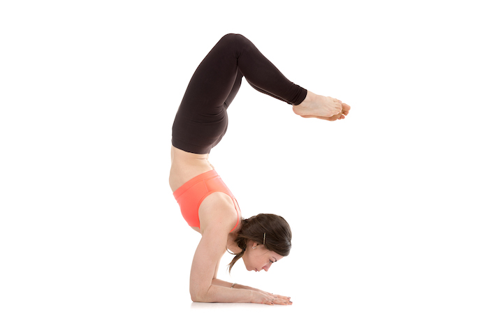 Woman Holds Pose in Blank Space | Scorpion Pose