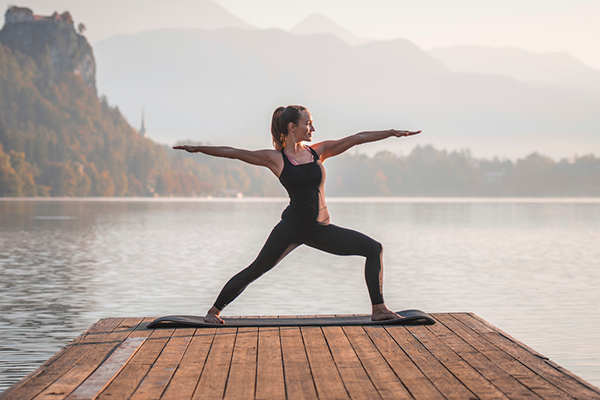 Woman Holds Warrior Pose | Post Run Yoga