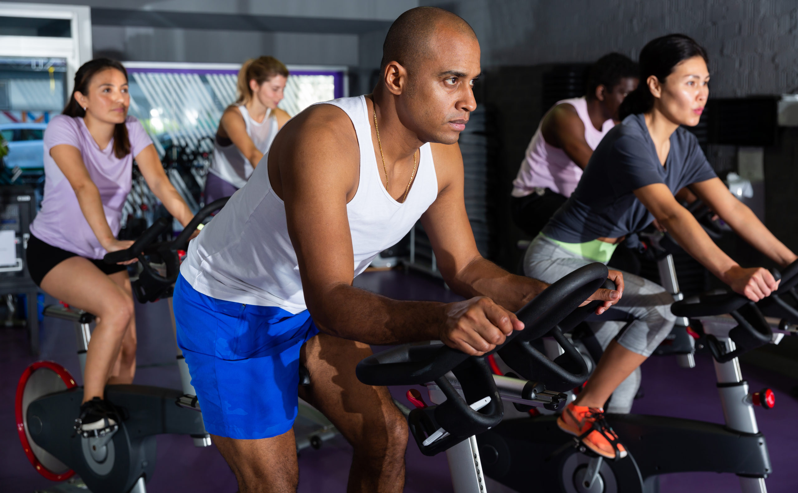 Man Cycling with Fitness Class | How to Engage Your Core