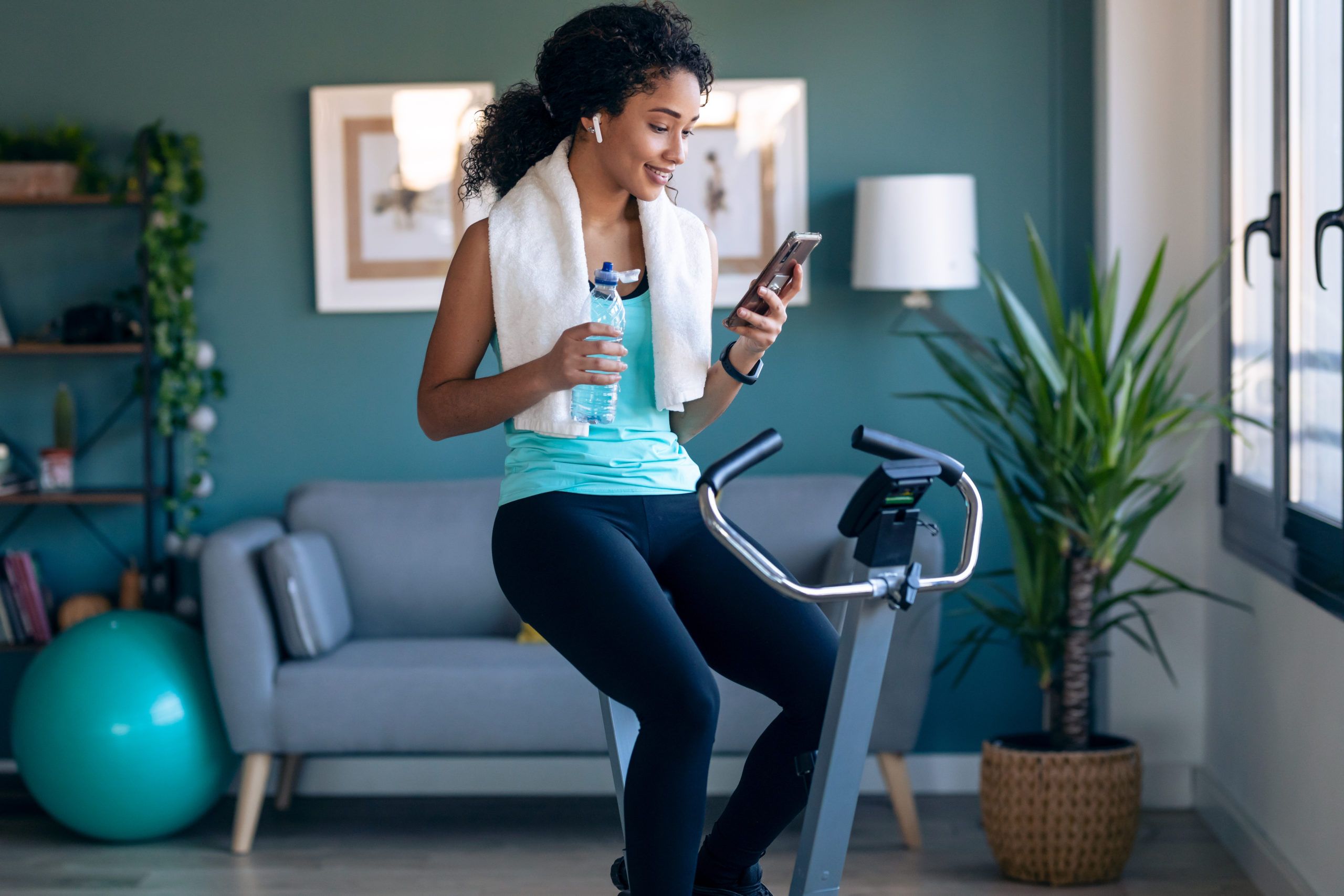 Woman takes Break on Stationary Bike | Indoor Cycling Mistakes