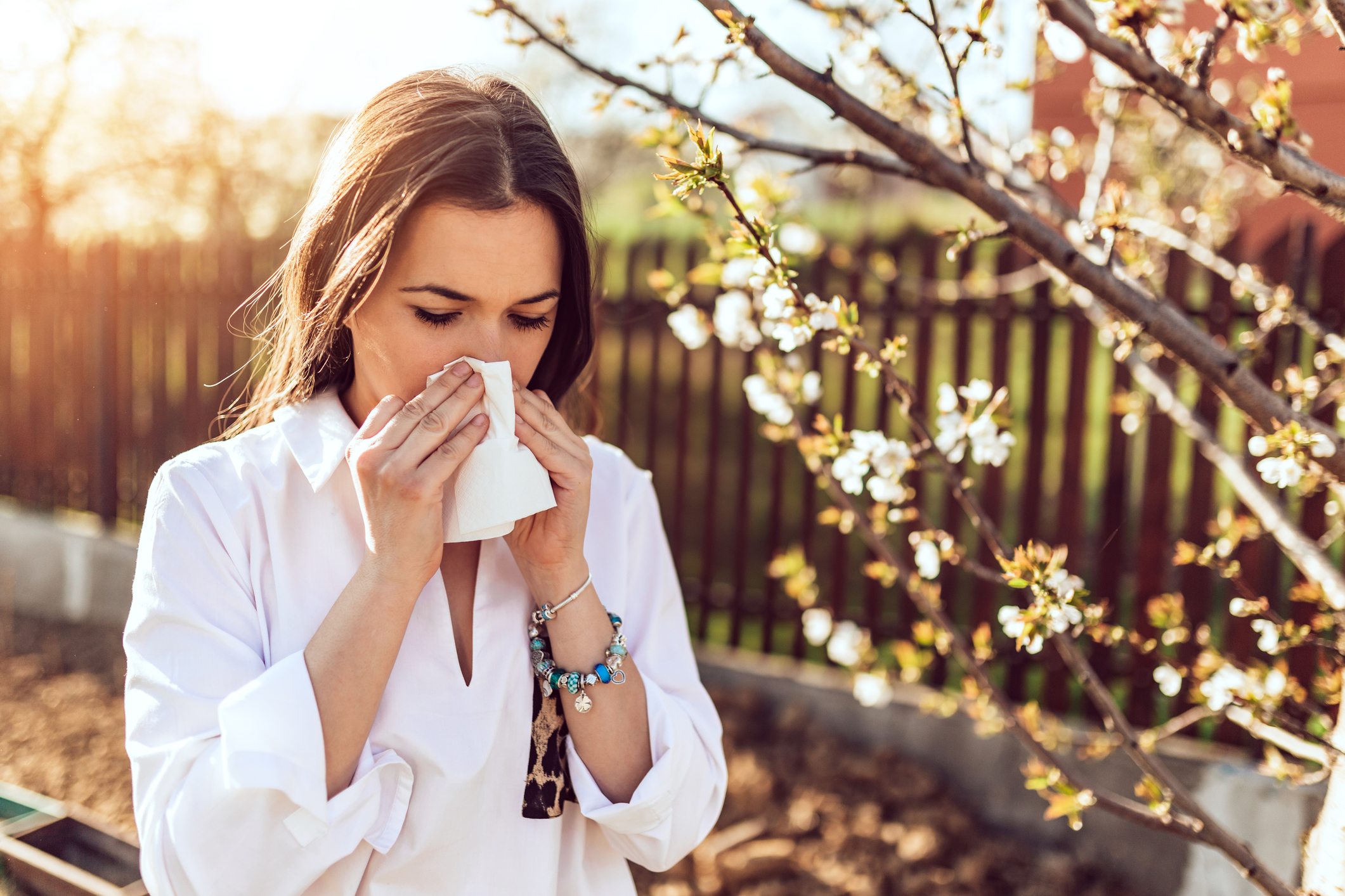 Woman Sneezes into Tissue | Foods High in Zinc