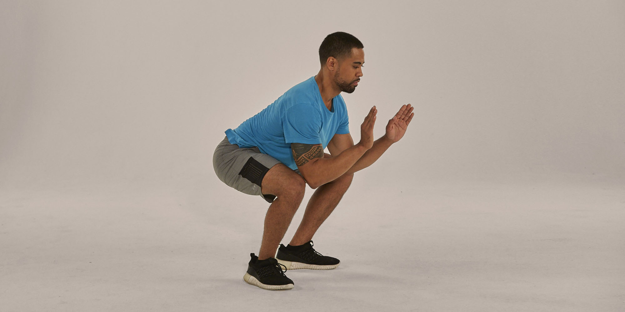 Man Holds a Low Squat | Isometric Exercise