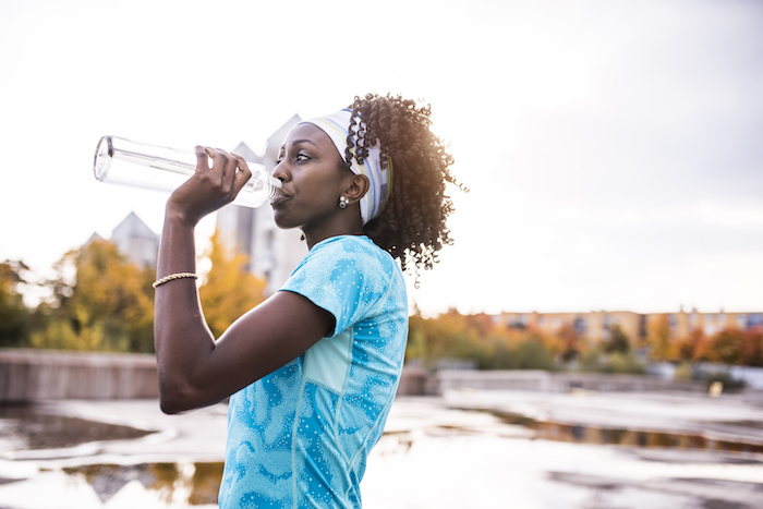 Woman Drinks Water During Workout | Fall Self Care Guide