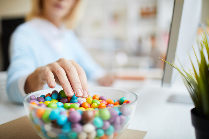 Woman Eats Candy in Office | How to Stop Eating Sugar