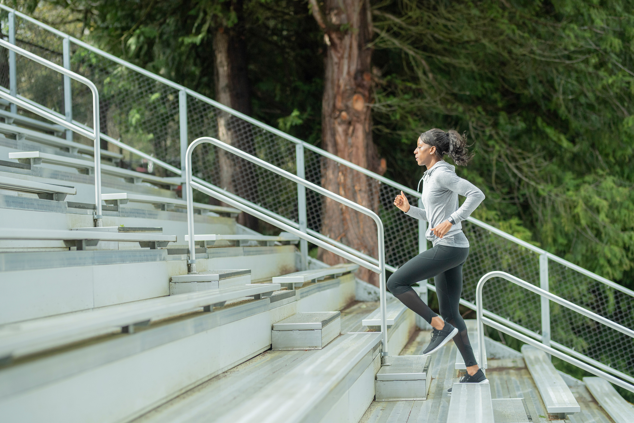 Woman Runs Up Stairs | 5 Components of Fitness