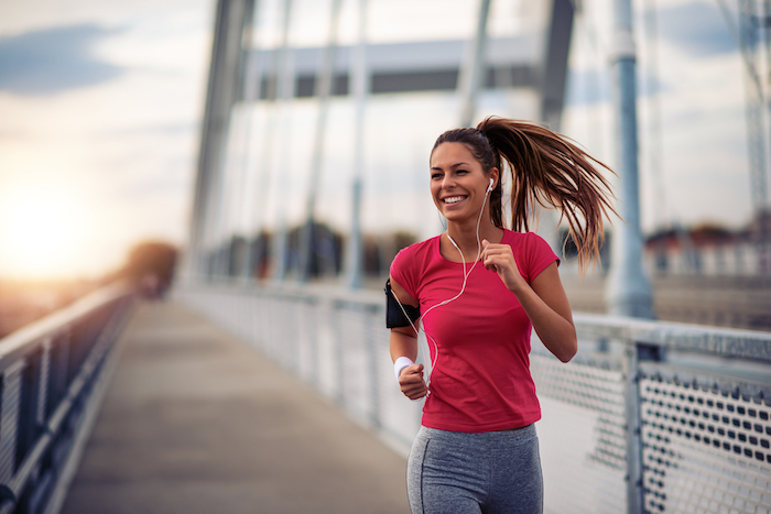 Woman Runs on Bridge | What to wear to pilates