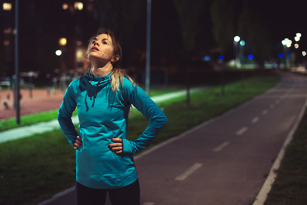 Woman Recovering After Run at Night | Overexertion