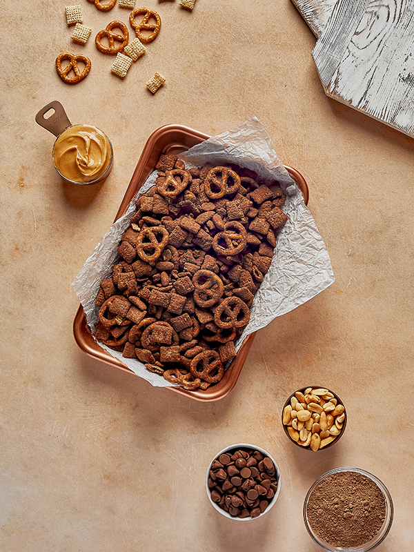 Chocolate Caramel Brownie Shakeology Muddy Buddies in a pan