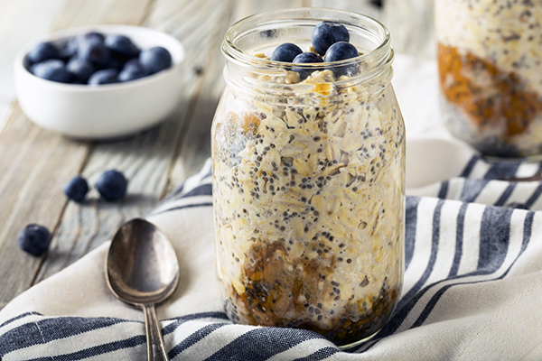 Blueberry Walnut Chocolate Caramel Brownie Overnight Oats in jar