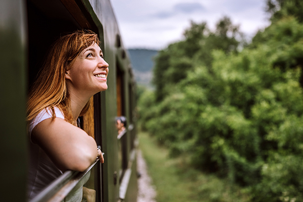 Woman Looks Out of Train Window | Benefits of Being Outside