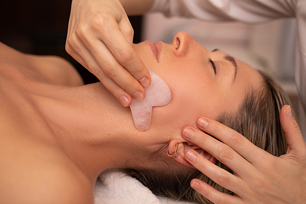 Close Up of Woman Receiving Gua Sha Massage | Gua Sha