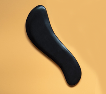 Close Up Shot of S Shape Gua Sha Tool | Gua Sha