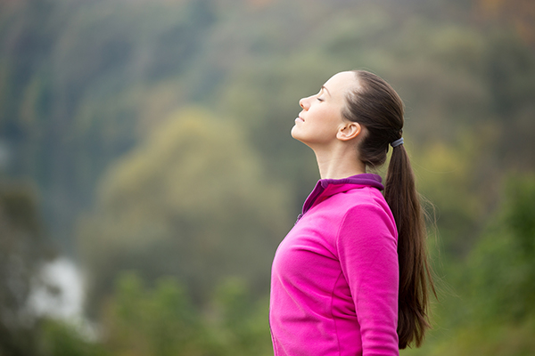 Woman Enjoys View From Hike | Daily Meditation Tips
