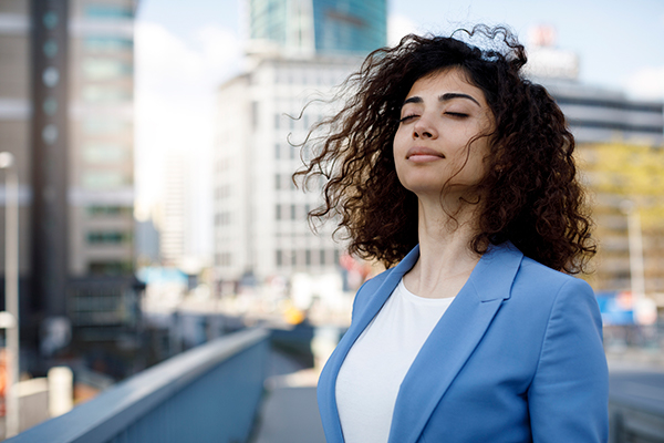 Professional Woman Enjoys Breeze | Daily Meditation Tips