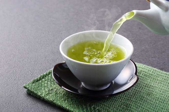 Cup of green tea served | antioxidant foods