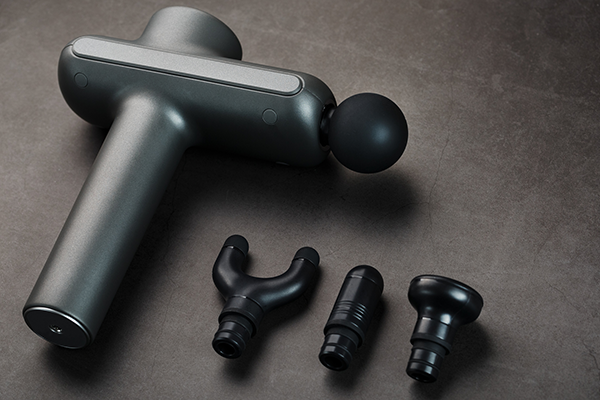 Overhead Shot of Massage Gun with Attachments | Percussive Therapy Devices