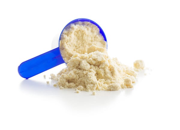 Close-up of protein powder in scoop |  Whey versus plant protein