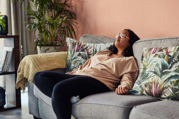 A woman relaxing on the sofa Morning meditation