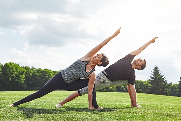 The couple does not form the side angle outside Yoga and meditation