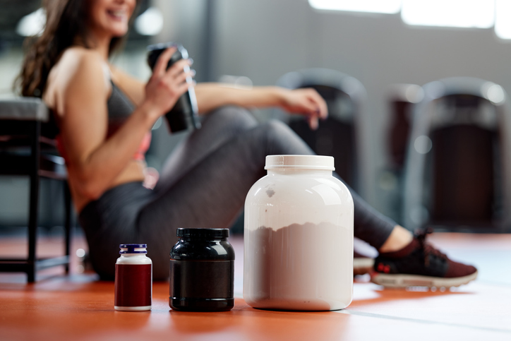 Athlete in Gym with Supplements | Energy drink before training