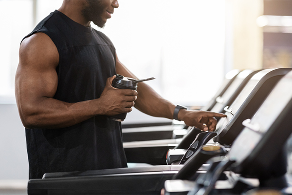 Athlete On Treadmill with Shaker | Creatine and Protein