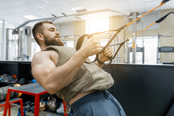 athlete does rows with a weighted vest | weighted vest