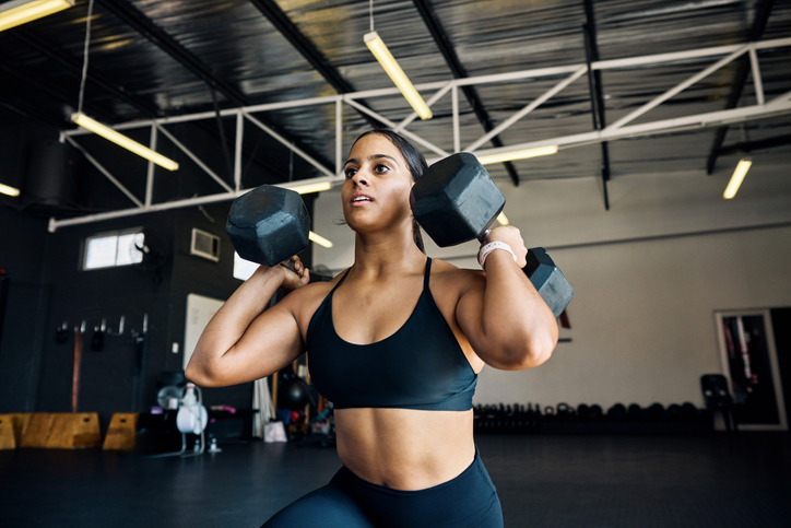 woman doing dumbbell workout | How to Boost Metabolism