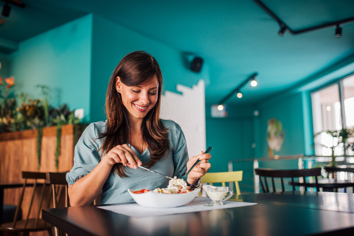 woman eating | Ozempic Foods to Avoid