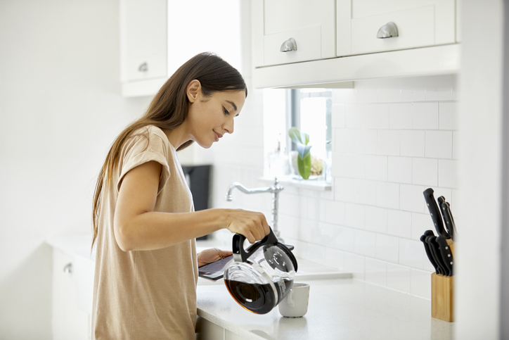 woman pouring coffee | How to Make Caffeine More Effective