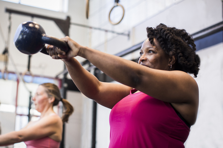 woman doing kettlebell swing | Mood Swings