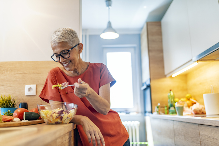 woman eating salad | Hot Flash Relief